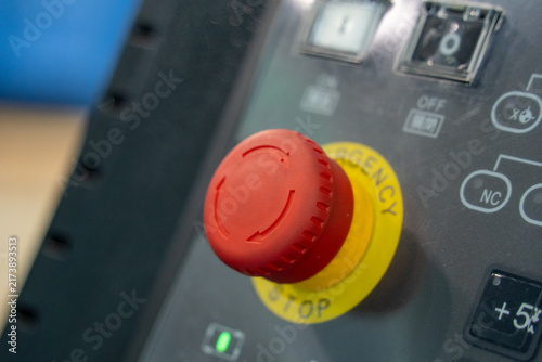 Foto Red Emergency Stop Button on Industrial Control Panel