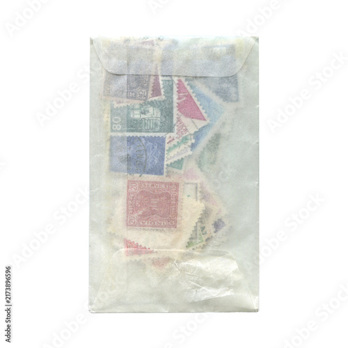 Obraz na płótnie Vintage Postage Stamps in Semitransparent Glassine Envelope Isolated on Transpar
