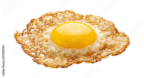 фотографія Crispy fried egg with a perfectly golden yolk and lacy edges