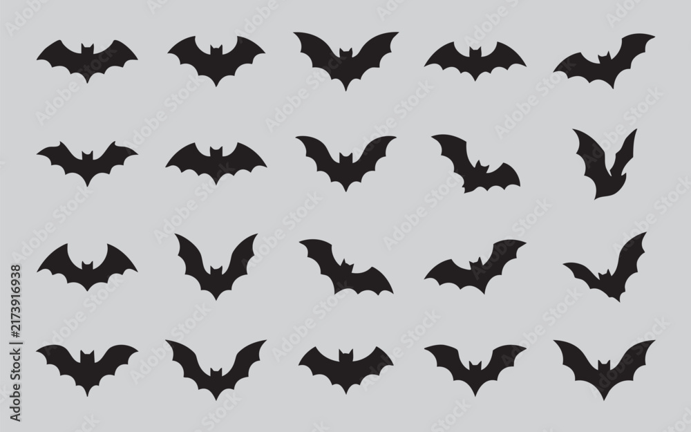 Fototapeta premium Collection of black bat silhouettes in various flying poses against a neutral background