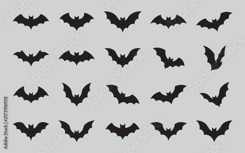 Collection of black bat silhouettes in various flying poses against a neutral background