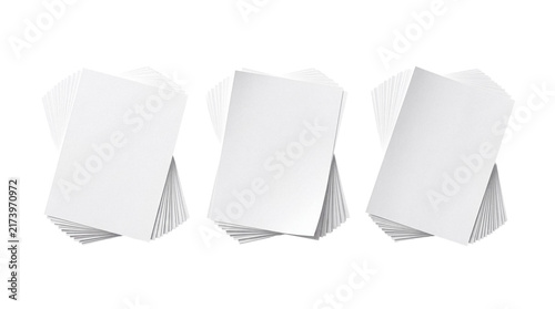 Three neatly stacked piles of blank white paper cards or sheets for business and personal use on transparent.
