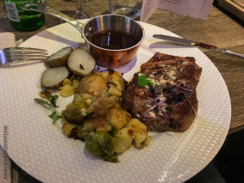 Grilled steak with blue cheese, roasted potatoes and Brussels sprouts