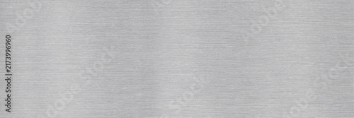Brushed Aluminum Metal Sheet. Stainless Silver Steel Texture Background. Smooth Industrial Surface. Modern Minimalist Grunge Wallpaper. Technology And Engineering Layout Concept.