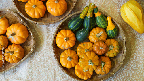 Colorful Mini Pumpkins and Ornamental Gourds in Woven Bamboo Baskets