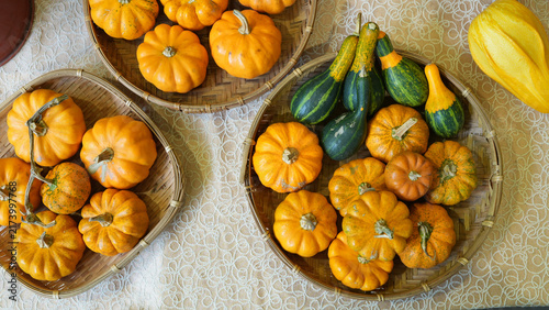 Colorful Mini Pumpkins and Ornamental Gourds in Woven Bamboo Baskets