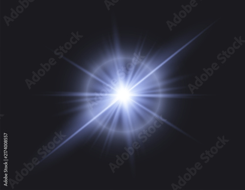 Bright blue lens flare with radiant starburst and glowing rays on dark background.