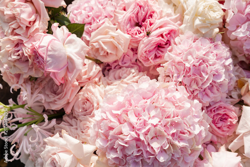 Full frame background of pastel pink hydrangeas and luxury roses