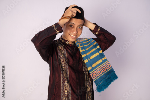 Konstfotografi Joyful Portrait of a Young Man in Traditional Attire with Vibrant Colors and a W