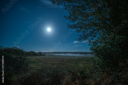 Canvastavla Night mist forms over a moonlit Cornish valley near Looe