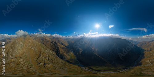 Fotografía Majestic Mountain Range with Sunbeams, Kyrgyzstan