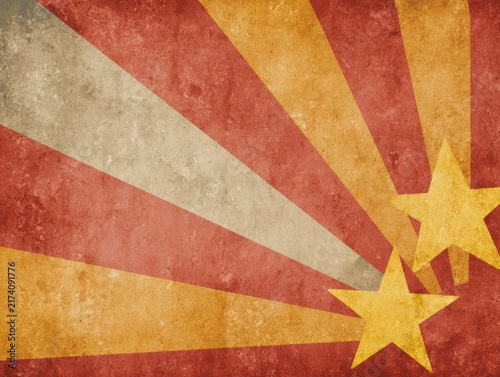 Vintage grunge red sunburst background with yellow stars. Retro patriotic, circus or military style texture and graphic design concept.