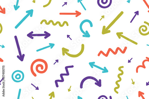 Seamless pattern featuring hand drawn colorful arrows, wavy lines, and spirals on white background