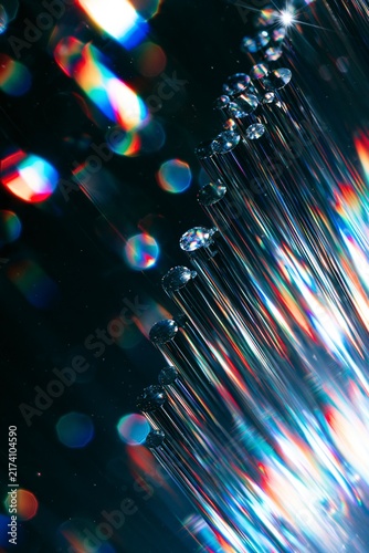 Abstract fiber optic light refraction with vibrant colorful bokeh and glow