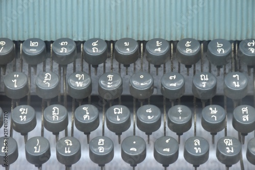 Fotografie close up of manual typewriter with Thai letter language QWERTY background and te