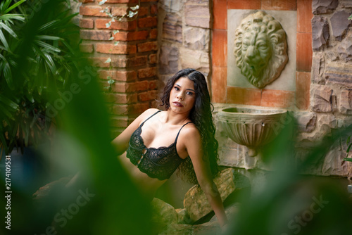 Bild auf Leinwand Sensual photoshoot of a beautiful young Brazilian woman; a beautiful young Brazilian woman in a sensual photoshoot during the Brazilian summer, natural light, selective focus