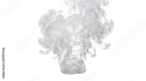 Dry ice sublimation with thick white smoke, frozen carbon dioxide block emitting vapor, cold steam effect on white background