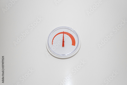 Fotografie Close up of temperature gauge dial indicator on water heater boiler system isolated on white background