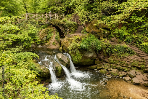 Schiessentümpel (or Schéissendëmpel) waterfall, located in the Mullerthal region, famously known as 