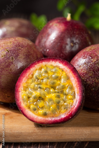fresh ripe passion fruits on wooden table