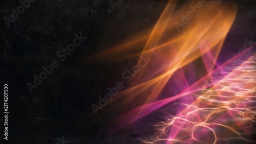 Abstract streaks of orange and pink light refract and dance across a dark, textured surface and rippling water