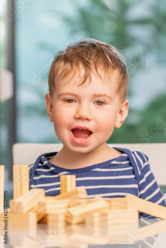Plakat Young builder proudly celebrating the result of his creative work.