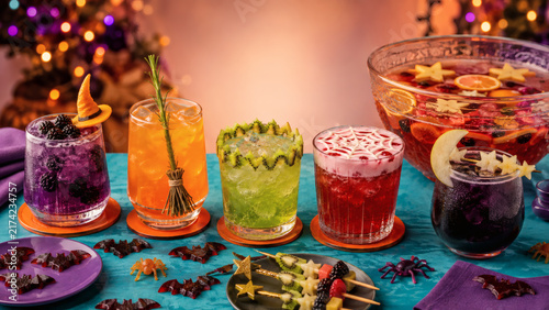 Colorful Halloween Mocktail Bar with Witch Broom Spiderweb and Moon Drinks