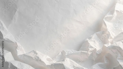 Abstract background of crumpled white paper with textured folds and shadows