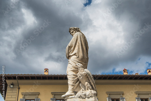 A statue of Dante Alighieri near the basilica of Santa Croce in Florence Italy