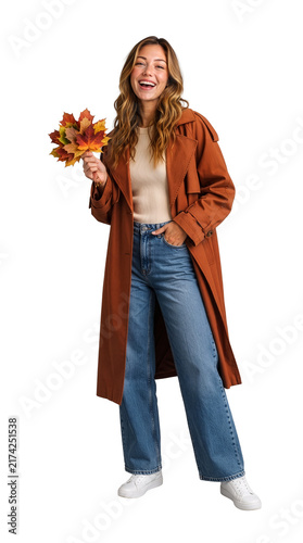 Smiling woman holding autumn maple leaves in brown coat and jeans isolated on transparent background