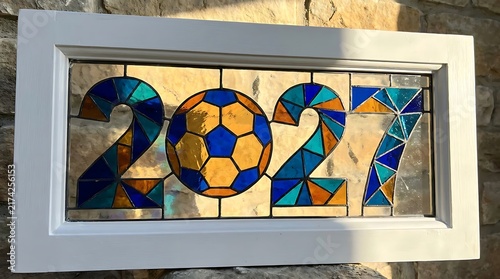 Stained glass mosaic art of 2027 with a soccer ball
