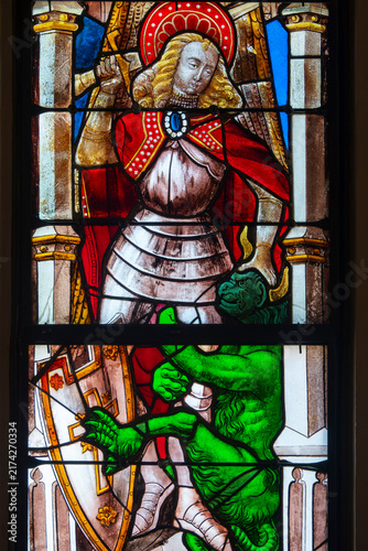 Photography Saint Michel the Archangel killing a demon.