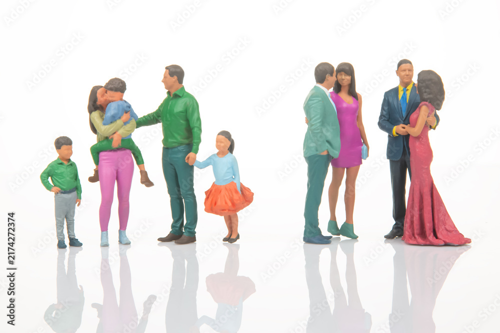 Obraz premium Miniature figures showing different groups of people in various outfits engaged in social interactions