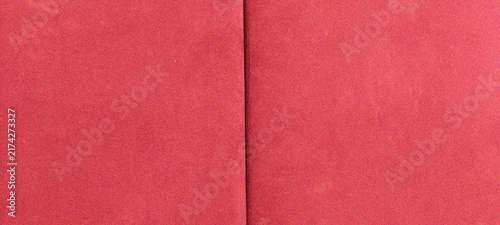 Red open notebook blank cover texture background with center fold seam for mockup and design