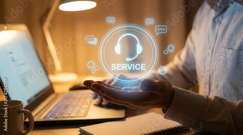 Hand holding holographic customer service headset icon