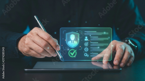 Hand with stylus pointing at holographic user profile screen