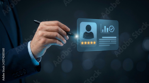Hand with pen pointing at holographic user rating dashboard