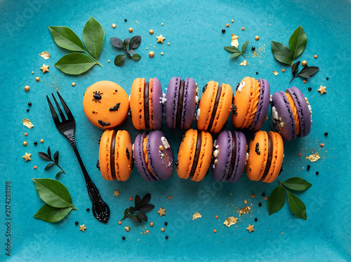 Halloween macarons decorated with spooky pumpkin and ghost designs for festive treats