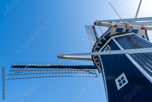 Blue windmill viewed from the bottom