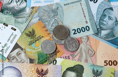 Konstfotografi Indonesian rupiah money banknotes and coins on table