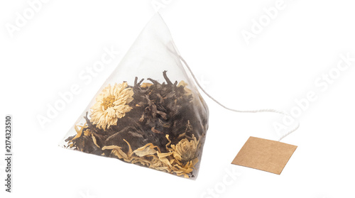 Cuadro en lienzo Pyramid tea bag with herbal infusion, organic loose leaf tea sachet with dried f