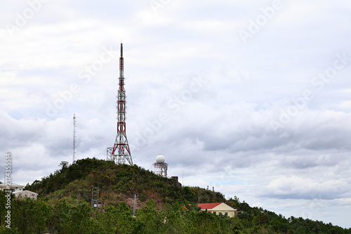 Cuadro en lienzo Telecommunication Tower on Hilltop Under Cloudy Sky