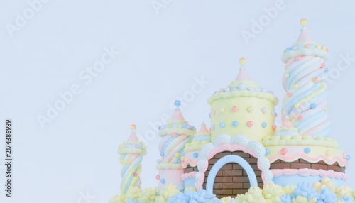 Whimsical Pastel Candy Castle with Swirled Towers Against Soft Light Background