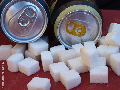 Soda can with excessive sugar cubes depicting high sugar content