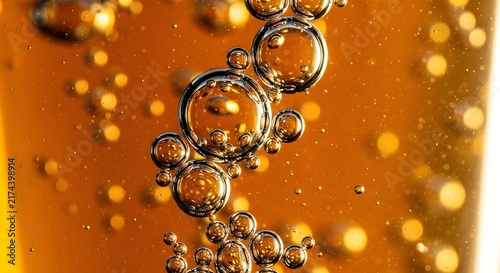 Golden Liquid Bubbles Macro Shot - Vibrant Orange Syrup or Honey Drops in Motion