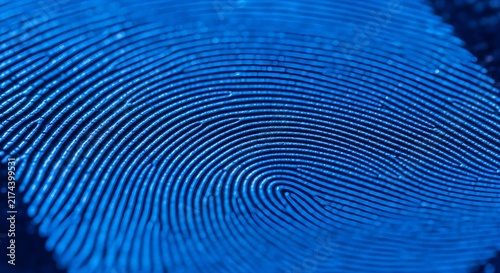 Close-up of human fingerprint with striking blue lighting for security, identity, and design projects