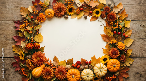 Premium 3D autumn greeting illustration with realistic stylized orange pumpkins, colorful fall leaves, acorns and wheat arranged beautifully around the edges