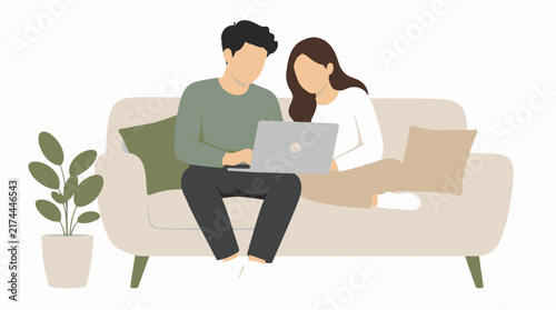 Couple using laptop on sofa
