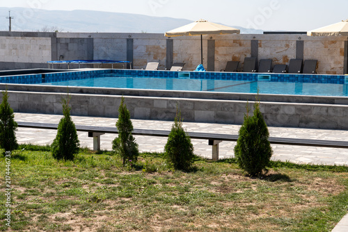 Outdoor Swimming Pool with Lounge Chairs.