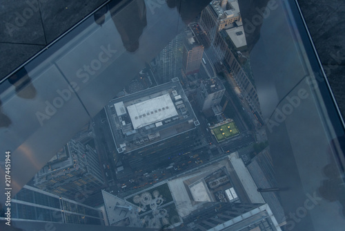 A dizzying view straight down from an observation balcony at dusk, Manhattan, New York City 